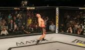 Potts celebrates after retaking the EFC AFRICA heavyweight title