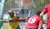 SA striker Julian Hykes shoots as Egypt's Hamada Atef looks on during the Greenfields World League Round 2 bronze medal match against Egypt at Hartleyvale in Cape Town Sunday.