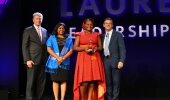 Monash South Africa student shows the world Ubuntu (L-R) Tim Daniels, CEO, Asia Pacific, Middle East and Africa, Laureate International Universities; Esther Benjamin, CEO Monash South Africa; Lebo Sekhotla; and Douglas Becker, Chairman and CEO, Laureate International Universities.