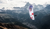 A Red Bull X-Alps athlete flying over Zermatt, Switzerland.