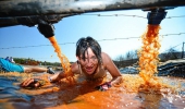 A Jeep Warrior competitors tackles one of the many muddy obstacles