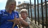 Volunteer Charmaine Augustyn and the young 3 year old Maxim Mandel