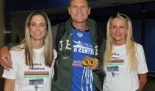 Hank McGregor (centre) is welcomed home by his wife Pippa (left) and mother Skyy McGregor at King Shaka International Airport on his return from the ICF Canoe Marathon World Championships.