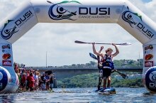 Andy Birkitt and Sibonelo Zondi celebrate winning the 2014 Dusi Canoe Marathon at the designated finish at Blue Lagoon on Day 3.