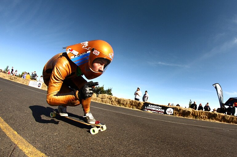 Feet are glued to the board as riders apex the tight, right corner. Blink and you'll miss them. Feet are glued to the board as riders apex the tight, right corner. Blink and you'll miss them.