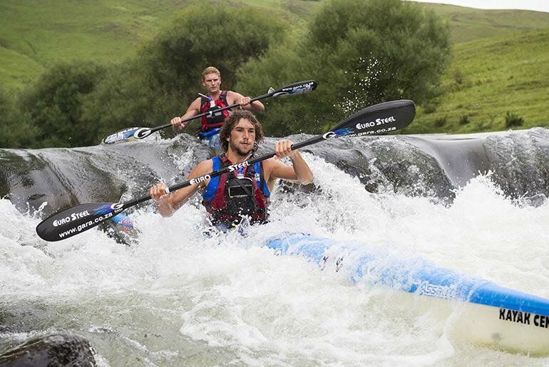 Andy Birkett leads Hank MacGregor through the drop off at the top of Glenhaven rapid.