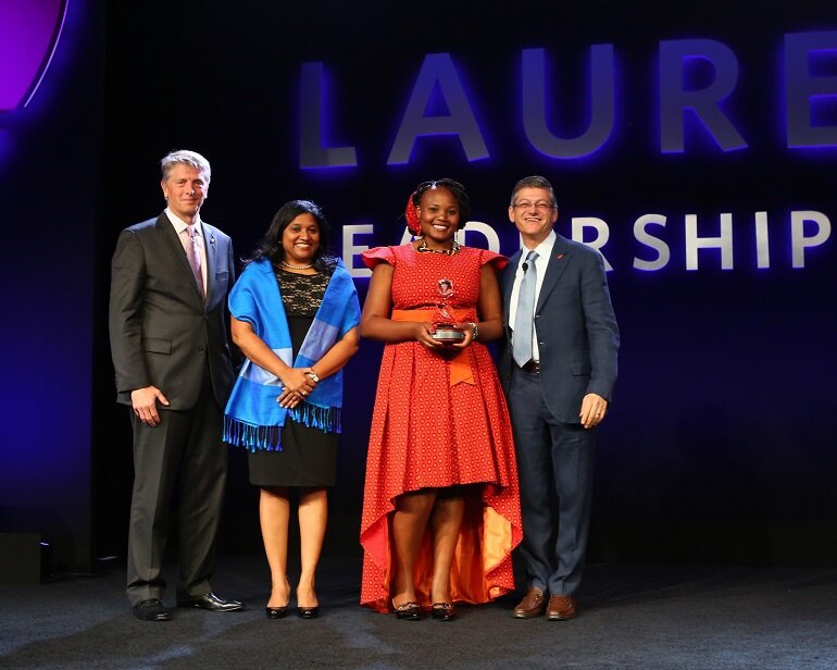 Monash South Africa student shows the world Ubuntu (L-R) Tim Daniels, CEO, Asia Pacific, Middle East and Africa, Laureate International Universities; Esther Benjamin, CEO Monash South Africa; Lebo Sekhotla; and Douglas Becker, Chairman and CEO, Laureate International Universities.