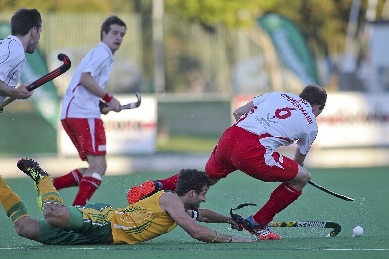 SA captain n WP centre back Austin Smith full stretch tackle Swiss's Pascal Zimmermann. 