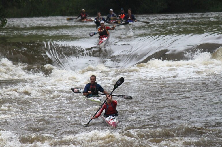 Bianca Haw leads dad Glen and a gaggle of the Haw family's paddling clan down the river. After a brief halt in the winter, the fierce family rivalry gets underway again on Friday 10 October in Cradock with the start of the 2014 Hansa Fish River Canoe Marathon.