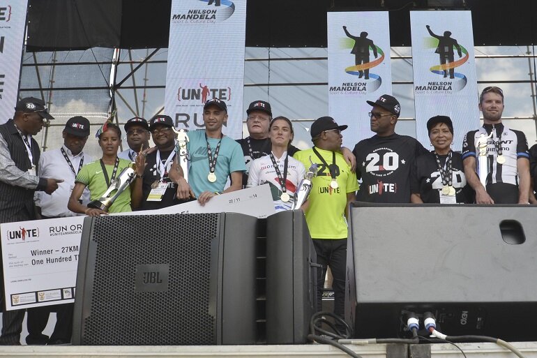 Ministers Fikile Mbalulaand Nathi Mthethwa celebrate the victory moment with the top winners. Ministers Fikile Mbalulaand Nathi Mthethwa celebrate the victory moment with the top winners.