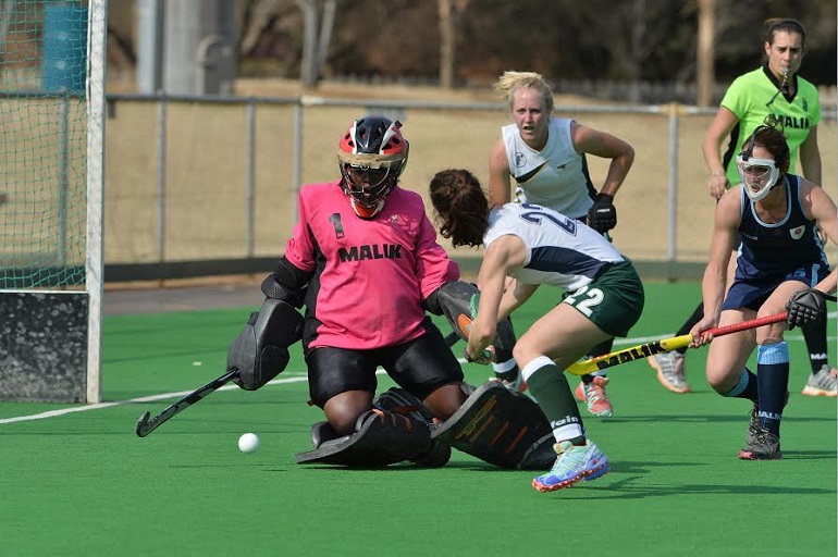 Free State's Lezanne Vermaak (left) scores the opening goal past Northern Blues goalkeeper Phume Mbande during the Bloemfontein girls' 2-1 win at the SA Interprovincial Tournament in Potchefstroom Thursday as Free State's Jo-Nelke Swanepoel and Blues' Kim Hubach (face mask) look on.